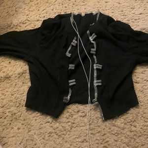 Long sleeve open breast top with the string cross.